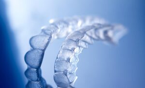 Clear aligners on blue background